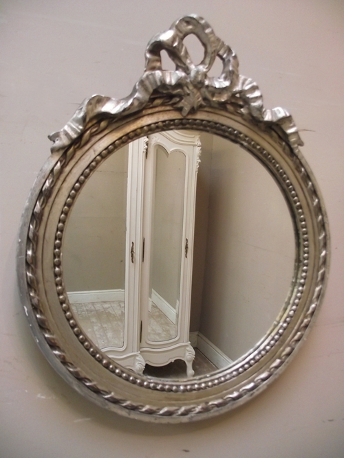 silvered round mirror